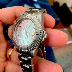 One Invicta Watch Peach Mother of Pearl Dial, Stainless Steal Bracelet.